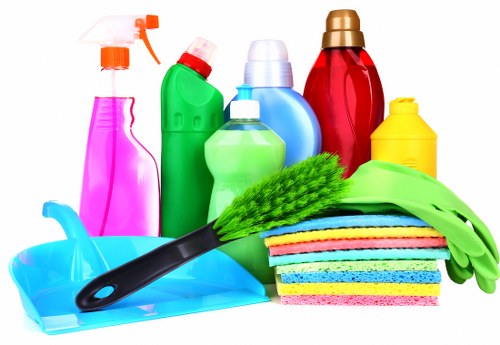 Professional move out cleaning in a bathroom with scrubbing and sanitizing