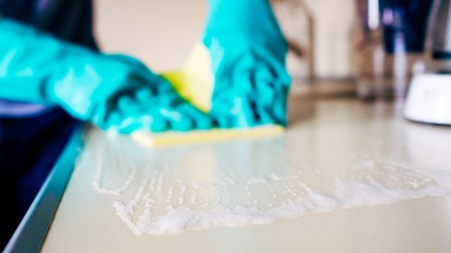 Janitorial staff performing commercial cleaning in a retail space
